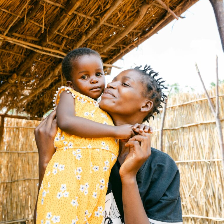 CH1953985 Mary and her daughter Flocy three near their home in Balaka district Malawi