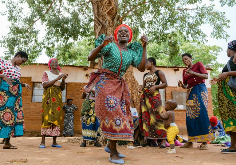 Women dancing during a care group session for mothers, in their community in Balaka district, Malawi. Sam Vox/Save the Children